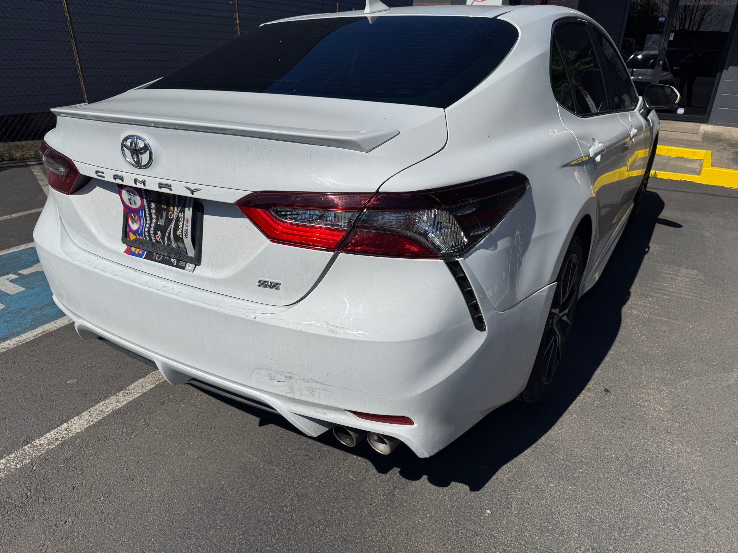 Collision repair in progress on a damaged vehicle inside Crown's body shop