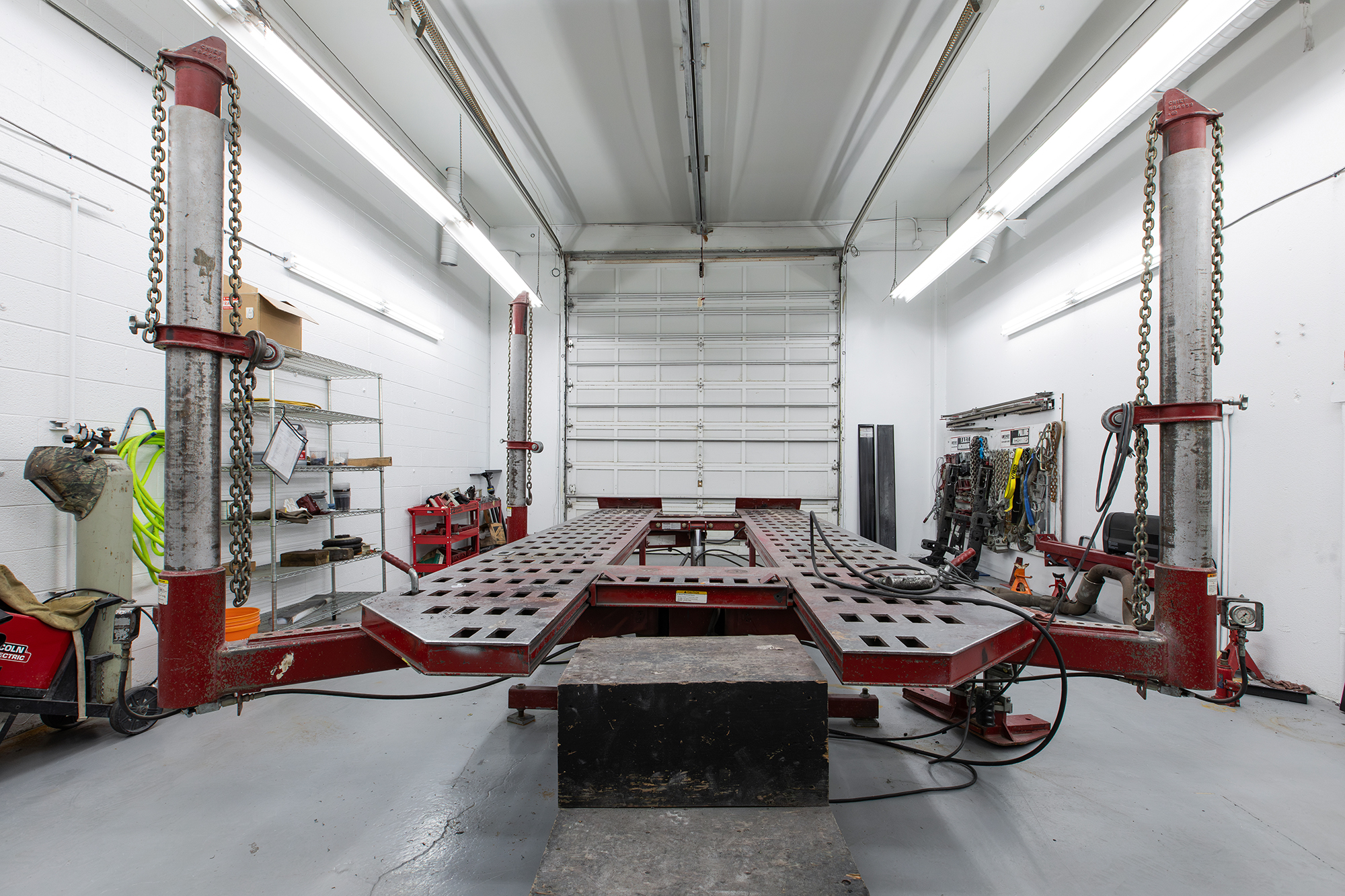 Vehicle mounted on a Chief frame rack for precision structural repair at Crown
